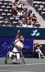 Male Tennis Player in Wheelchair Serving- Photo : NSIC Collection 